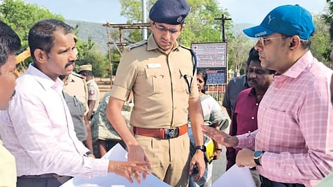 Madurai Collector Praveenkumar and SP Arvind reviewing
preparations at the Kallalazhagar temple on Saturday