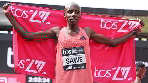Sebastian Sawe from Kenya celebrates winning the men’s race at the London Marathon in London, Sunday, April 26, 2026 
