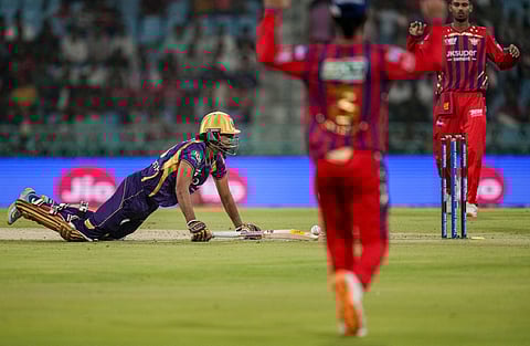 Kolkata Knight Rider's Angkrish Raghuvanshi dives to reach the crease during the Indian Premier League (2026) T20 cricket match between Lucknow Super Giants and Kolkata Knight Riders, in Lucknow, Uttar Pradesh, Sunday, April 26, 2026. 