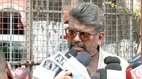 Actor Parthiban speaks to the press.