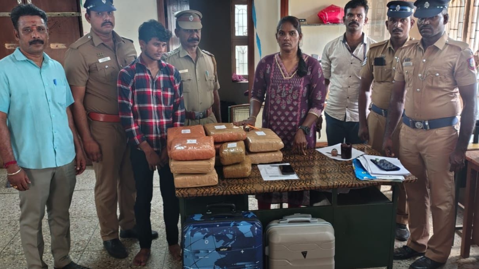 Railway police team with seized ganja and the smuggler in Tiruchy on Wednesday 