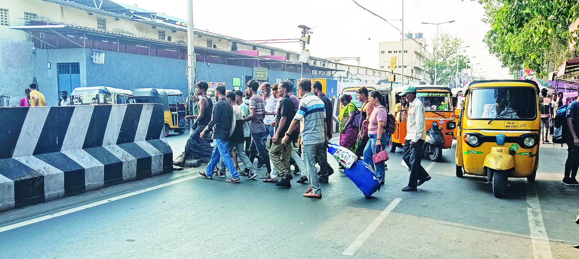 People crossing busy Wall Tax Road near Central railway station