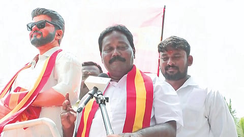 TVK’s victorious candidate Navalpattu S Viji campaigns alongside a hologram of party chief Vijay in Thiruverumbur 
