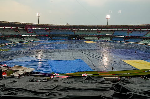 The ground remains covered amid rainfall before an Indian Premier League (IPL) 2026 T20 cricket match between Royal Challengers Bengaluru and Kolkata Knight Riders, in Raipur, Chhattisgarh, Wednesday, May 13, 2026