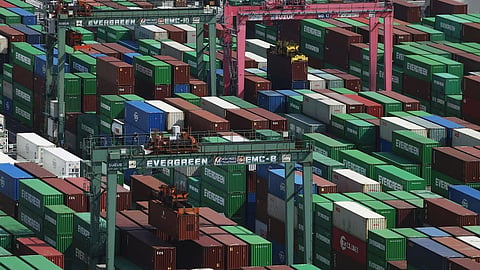 Containers are stacked at a port in Tokyo Tuesday, May 19, 2026. 