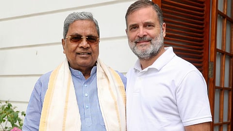 Rahul Gandhi with party leader Siddaramaiah during a meeting after the latter stepped down from the post of Karnataka Chief Minister