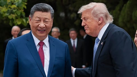 US President Donald Trump, right, speaks with Chinese President Xi Jinping