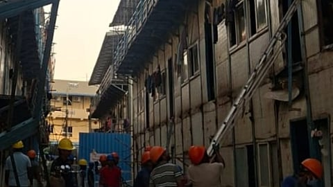 staircase handrail collapsed at a temporary workers' accommodation in Nandambakkam