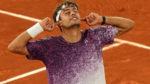 taly's Flavio Cobolli reacts after winning the quarterfinal tennis match against Canada's Felix Auger-Aliassime at the French Open in Paris