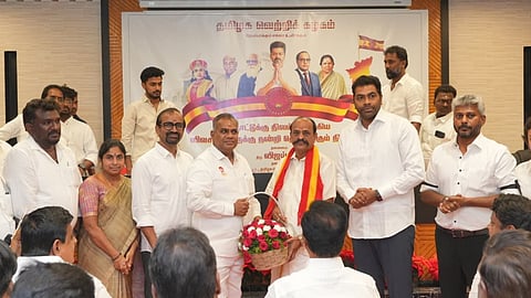 AIADMK former minister joining TVK in the presence of party general secretary N Anand in Chennai on Saturday