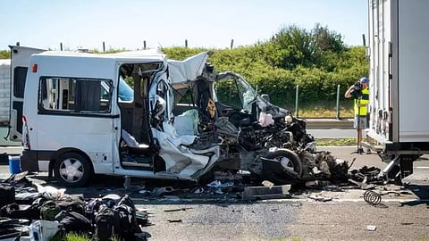 A damaged minibus is seen on the M1 motorway near Gyor, Hungary,after the vehicle ran into a truck that had come to a stop due to a previous accident.

