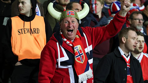 A Norway fan fan cheers during world cup soccer