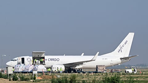 An Afcom Cargo aircraft receives a ceremonial water cannon salute after landing with the first cargo flight at Noida International Airport, in Jewar, Uttar Pradesh, Wednesday, June 17, 2026 