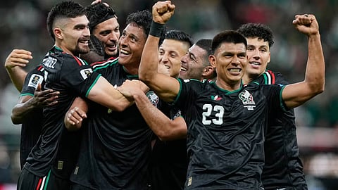Mexico's Luis Romo, third left, celebrates with his teammates after scoring g his team's first goal during the World Cup Group A