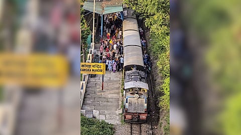 Passengers travelling in an overcrowded train in Himachal Pradesh.