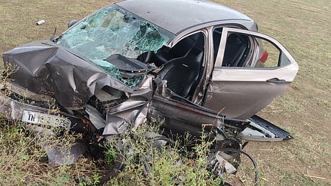 Mangled remains of the car that crashed into a roadside tree on  Tenkasi-Madurai National Highway early Tuesday