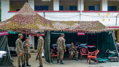 Security personnel at the site after an under-construction warehouse collapsed on Wednesday
