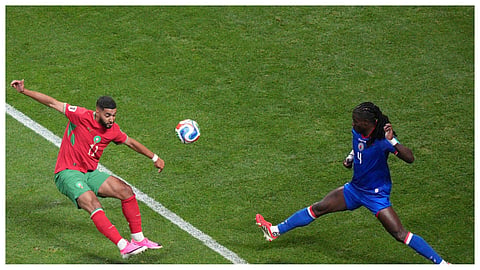 Morocco's Ismael Saibari (11) kicks the ball past Haiti's Ricardo Ade (4) during the World Cup Group C soccer match between Morocco and Haiti in Atlanta.