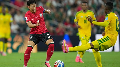 South Korea's Son Heung-min (7) controls the ball against South Africa's Thapelo Maseko (12) during the World Cup Group A soccer match between South Africa and South Korea in Guadalupe, near Monterrey, Mexico