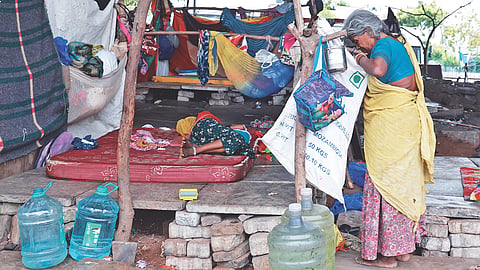 A family living with makeshift adjustments under the Velachery Bridge