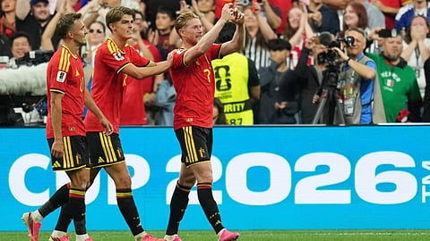 Belgium's Kevin De Bruyne (7) celebrates with teammates after scoring his team's third goal during the World Cup Group G soccer match between New Zealand and Belgium in Vancouver, British Columbia.