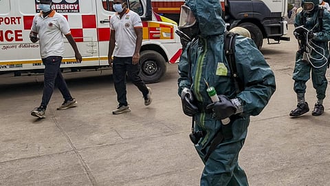 National Disaster Response Force (NDRF) personnel arrive at a seafood export unit following an ammonia gas leak, in Manjangaranai, Tiruvallur district