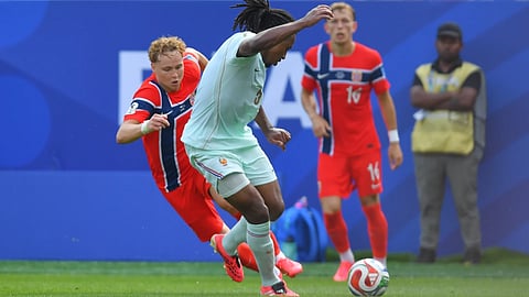 France's Jules Kounde (5) plays the ball against Norway's Andreas Schjelderup (21) during the World Cup Group I soccer match between Norway and France in Foxborough, Mass., near Boston