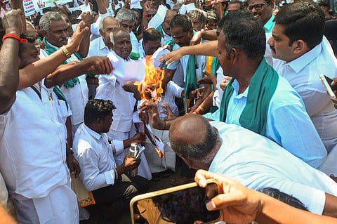 Cauvery Rights Retrieval Committee members in Thanjavur burning copies of resolution for Mekedatu tribunal in Tamil Nadu Assembly floor