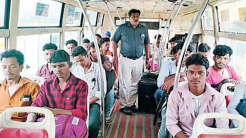 Workers aboard a bus 
