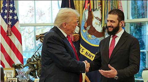 US President Donald Trump, left, shakes hands with Syria's President Ahmad al-Sharaa at the White House in Washington, Monday, Nov. 10, 2025.  