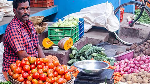 Image of man selling vegetables used for representative image
