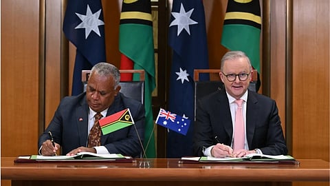 Prime Minister of Vanuatu Jotham Napat, left, and Australian Prime Minister Anthony Albanese sign the Nakamal agreement at Parliament House in Canberra