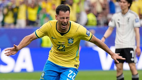 Brazil's Gabriel Martinelli (22) celebrates after scoring his side's second goal during the World Cup round of 32 soccer match between Brazil and Japan in Houston