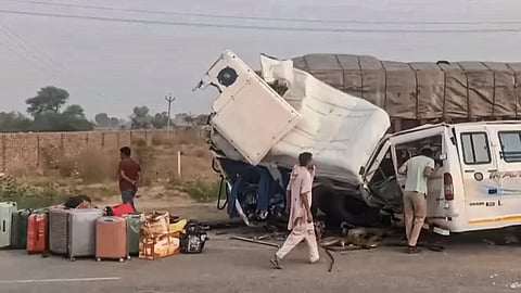 People look at the mangled remains of vehicles after a tempo-traveller rammed a stationary truck, killing four pilgrims from Rajasthan, including two women, on the Bathinda-Dabwali highway in Punjab's Bathinda district, Wednesday, July 1, 2026