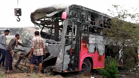 A bus stands gutted in fire after it collided with a truck on the Delhi-Mumbai Expressway, in Dausa, Rajasthan, early Wednesday, July 1, 2026. Eight people were killed