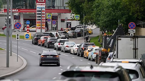 Cars line up at a Lukoil gas station in Moscow, Monday, June 29, 2026.