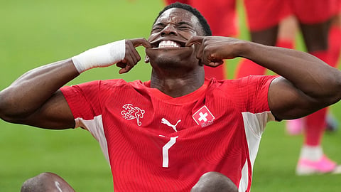 Switzerland's Breel Embolo (7) celebrates after scoring his team's first goal during the World Cup round of 32 soccer match between Switzerland and Algeria 