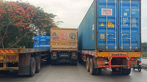 Container trucks parked along the NCTPS Road on Friday