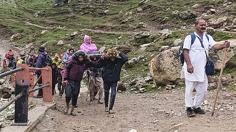 Pilgrims proceed towards the holy cave shrine of Amarnath, during the ongoing annual 'Amarnath Yatra', in Pahalgam, Anantnag district, Jammu and Kashmir