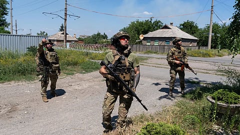In this photo provided by Ukraine's 93rd Kholodnyi Yar Separate Mechanized Brigade press service, Soldiers of the Alcatraz batalion, patrol the frontline city Druzhkovka, Donetsk region, Ukraine.
