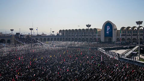 Mourners pray during funeral prayers held as part of the dayslong funeral ceremonies for the slain Iranian Supreme Leader Ayatollah Ali Khamenei and members of his family at the Imam Khomeini Mosalla Grand Mosque in Tehran, Iran