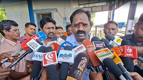 Forests Minister RV Ranjith Kumar addressing the reporters after inspecting a railway level crossing in Kancheepuram.