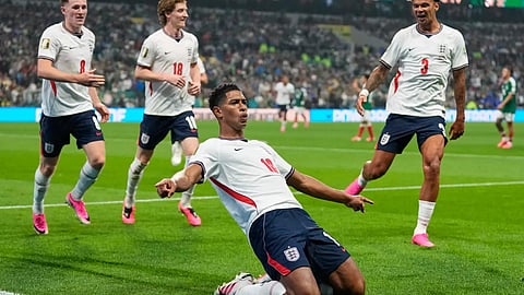 England's Jude Bellingham (10) celebrates with teammates after scoring his second goal during the World Cup round of 16 soccer match between Mexico and England in Mexico City.