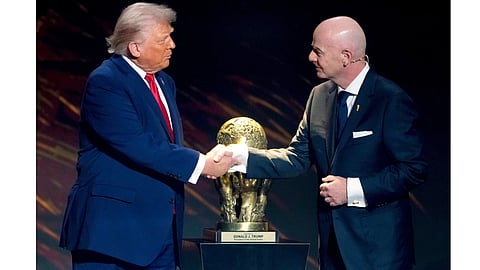 FIFA President Gianni Infantino, right, awards President Donald Trump with the FIFA Peace Prize during the draw for the 2026 soccer World Cup at the Kennedy Centre
