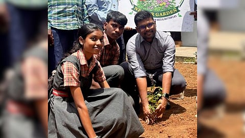 District Forest Officer N Vengatesh Prabhu plants a sapling at the pollinator garden in Coimbatore.
