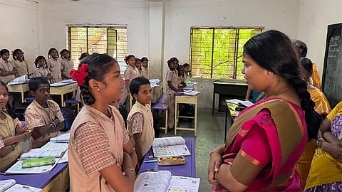  Minister Keerthana talking to a school kid