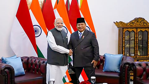 Prime Minister Narendra Modi embraces Indonesian President Prabowo Subianto upon his arrival at the Istana Merdeka for a ceremonial welcome, in Jakarta