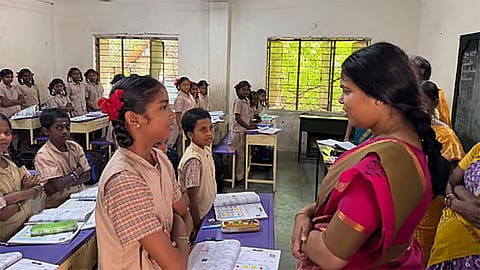 Minister Keerthana talking to a school kid