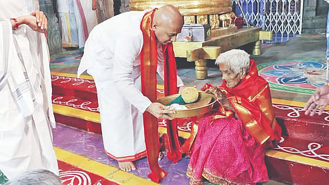 Navaneethamma being presented with prasadham
