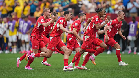 Switzerland players celebrate after defeating Colombia in a penalty shootout in the World Cup round of 16 soccer match between Switzerland and Colombia in Vancouver, British Columbia, Tuesday, July 7, 2026. 